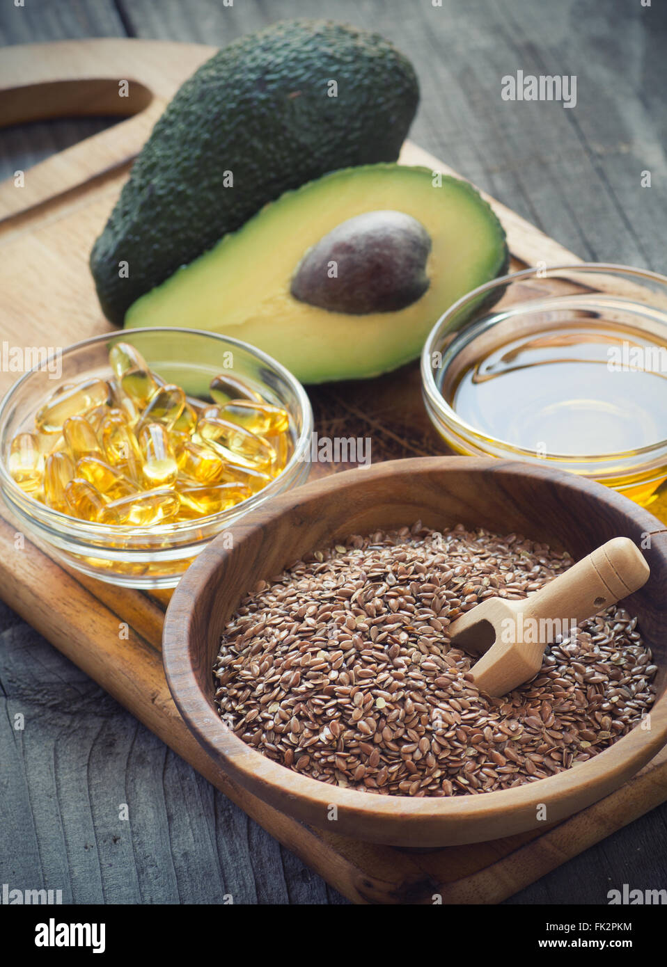 Sources of omega 3 fatty acids flaxseeds, avocado, oil capsules and