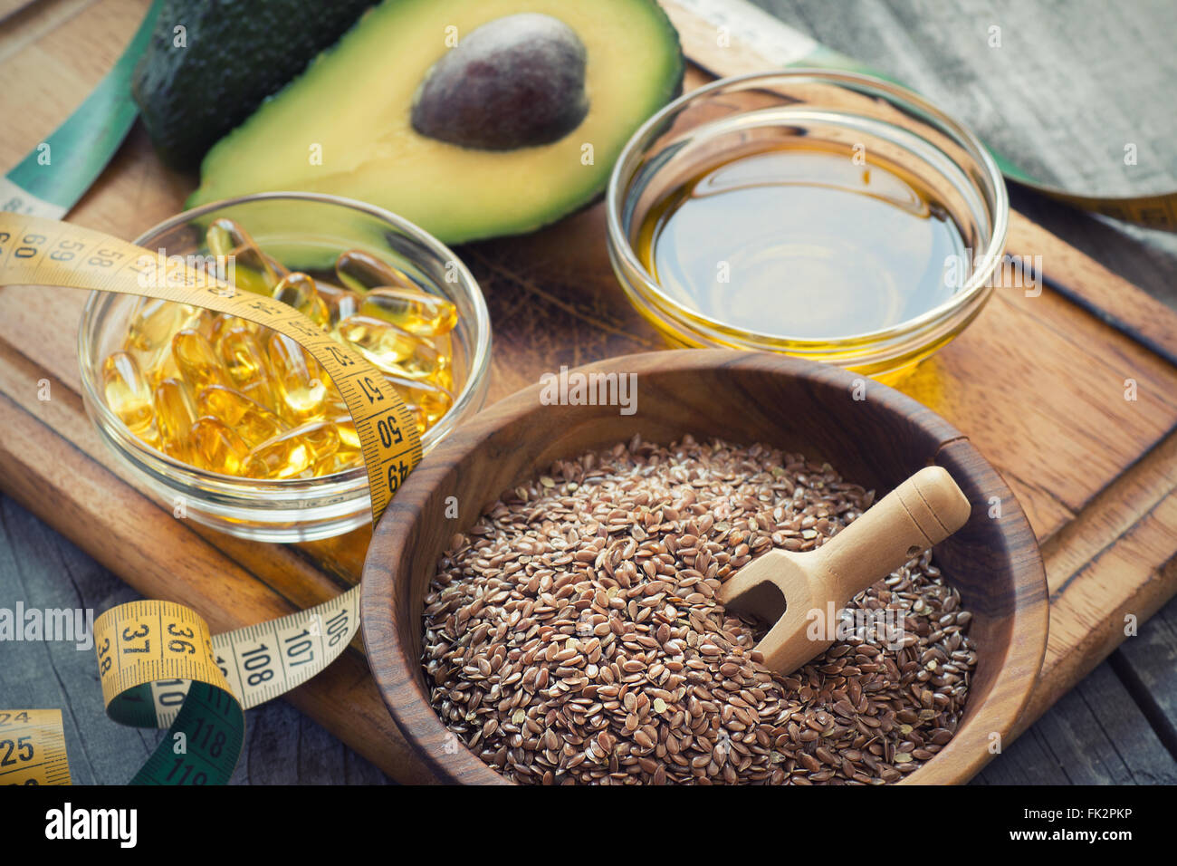Sources of omega 3 fatty acids flaxseeds, avocado, oil capsules and
