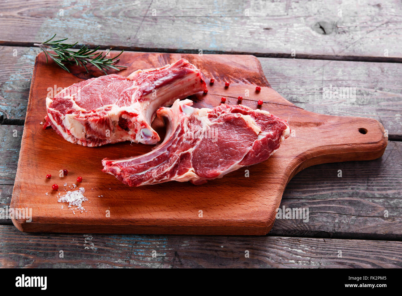 veal lamb steak on the bone of raw cutlets Stock Photo