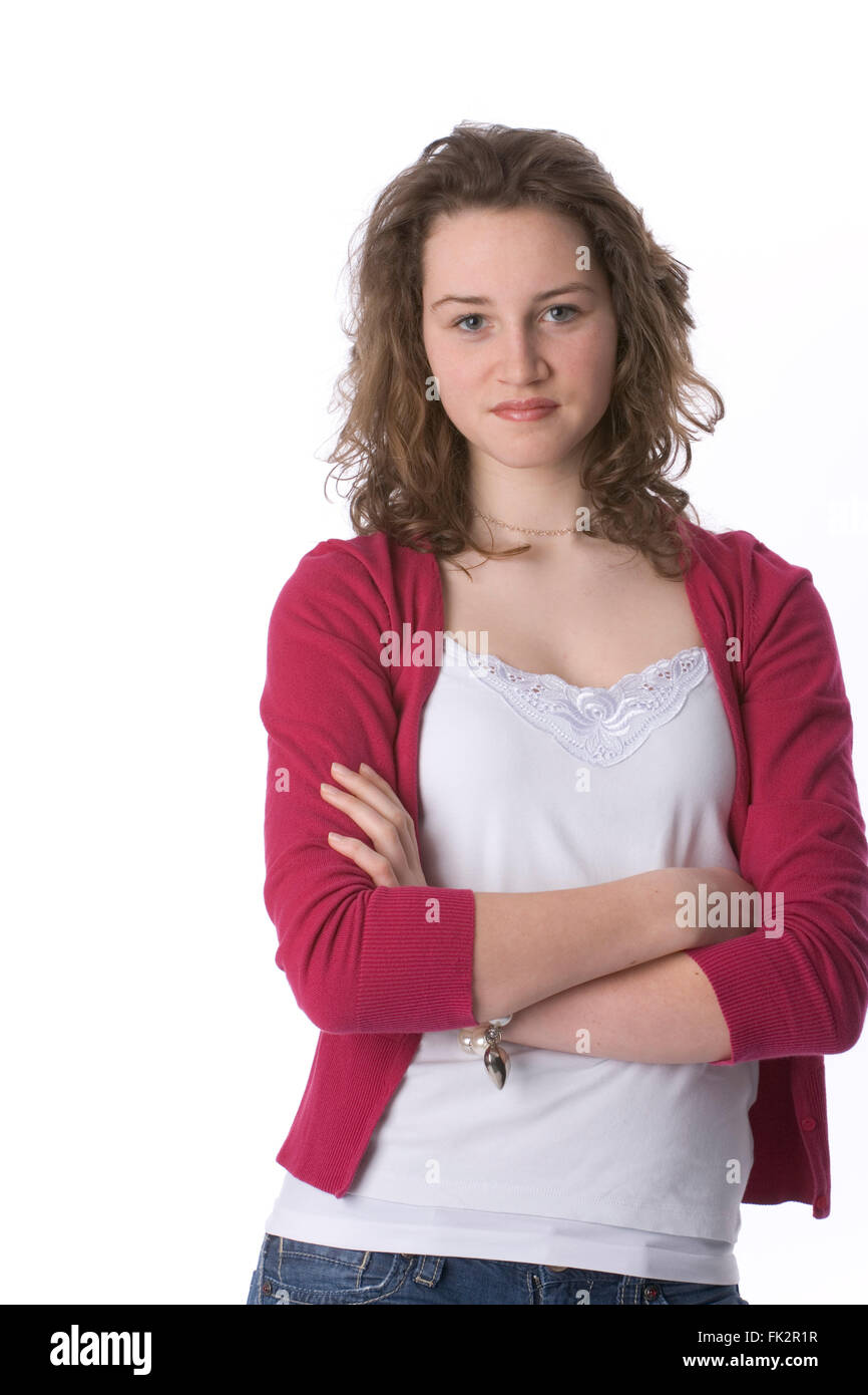 Portrait Of A Self-assured Teenage Girl On White Background Stock Photo