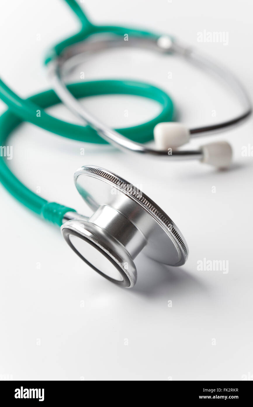 Green Stethoscope on white background Stock Photo