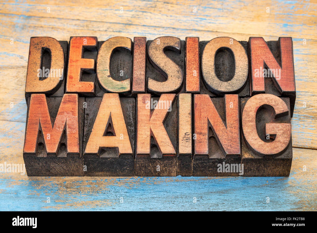 decision making word abstract  in vintage letterpress wood type printing blocks stained by color inks Stock Photo