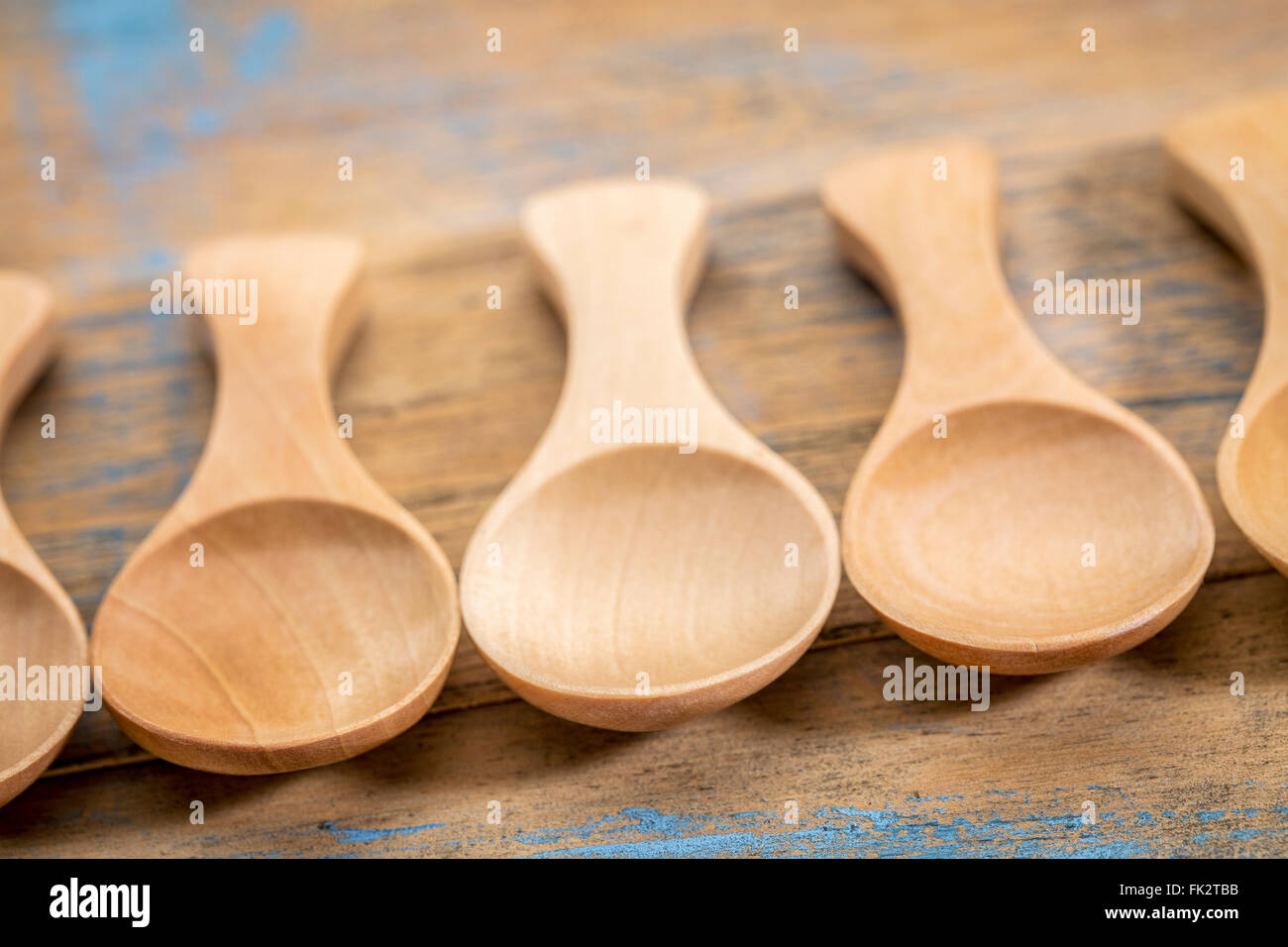 spoon abstract - a row of empty wooden tablespoon with a shallow depth of field Stock Photo