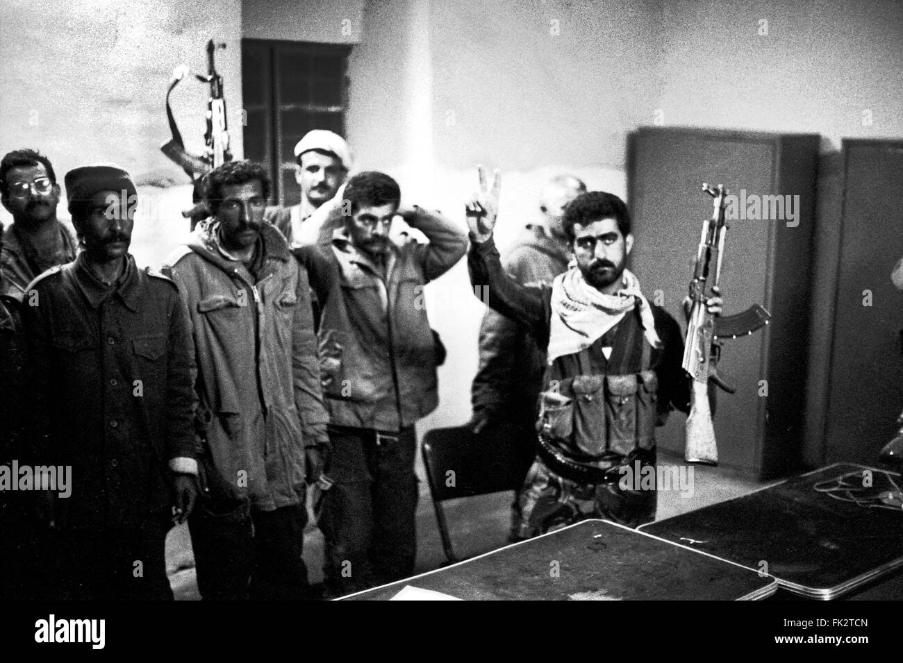 Zakho, northern Iraq, Kurdistan. March 1991. Fighters from the Kurdistan Front with captured prisoners of the Iraqi army at night, during the uprising by Kurds against forces of Saddam Hussein's government. Photo by:Richard Wayman Stock Photo