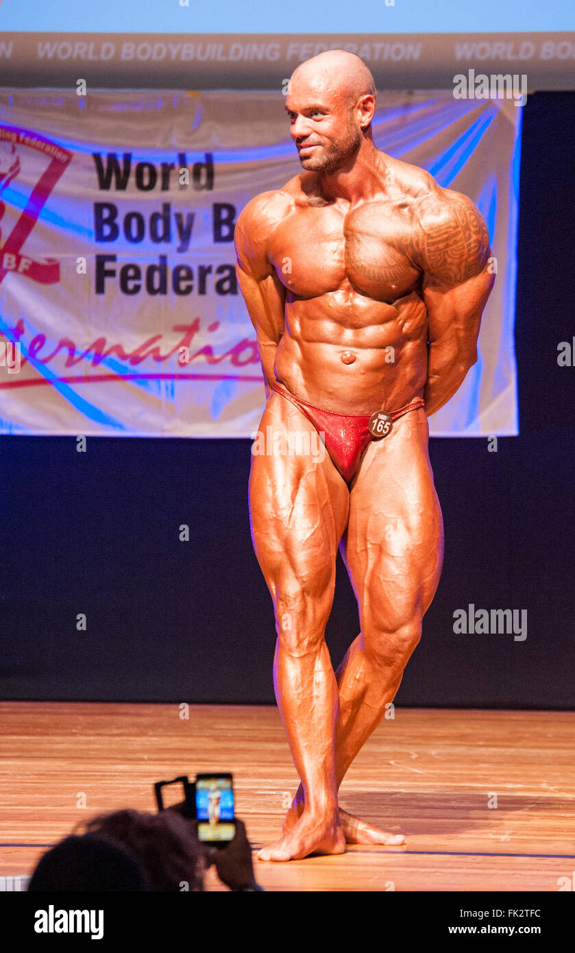 MAASTRICHT, THE NETHERLANDS - OCTOBER 25, 2015: Male bodybuilder Aron Winnelinckx shows his best abdominal and thighs pose Stock Photo