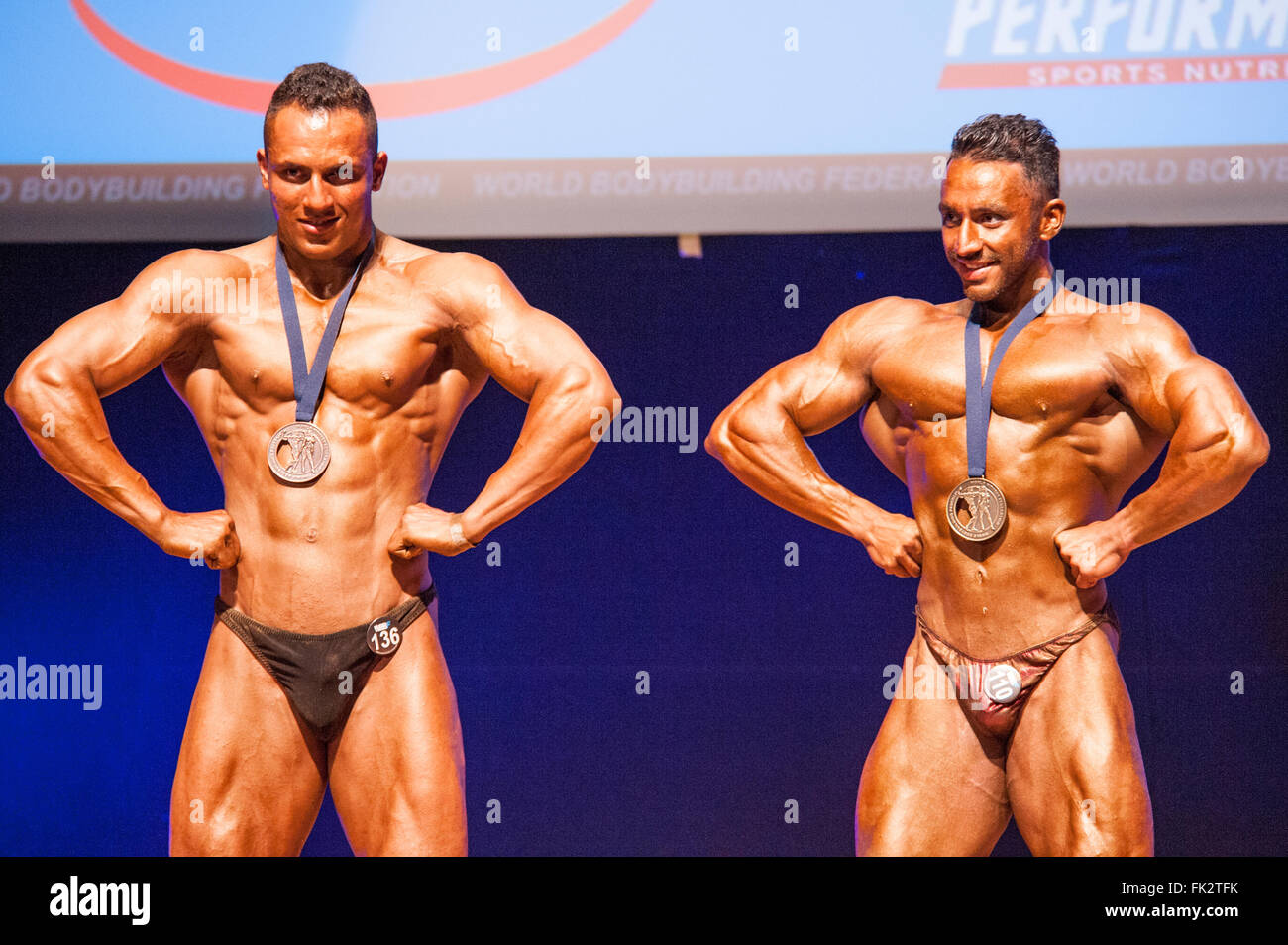 MAASTRICHT, THE NETHERLANDS - OCTOBER 25, 2015: Male bodybuilders celebrate their championship victory on stage Stock Photo