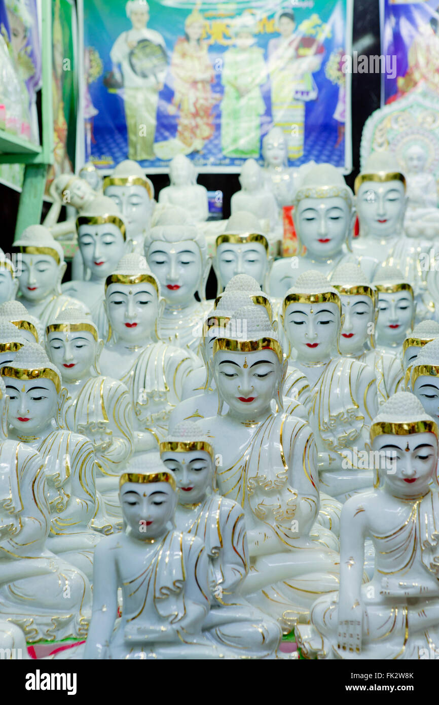 Ceramic sitting Buddhas for sale in a tourist shop in a market in Mandalay, Myanmar, Asia Stock Photo