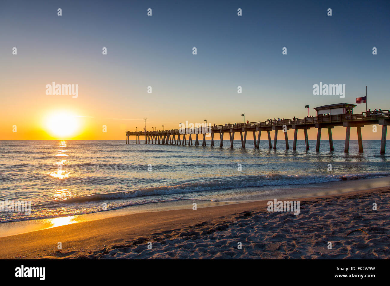 Sunset over Gulf of Mexico and Venice Pier in Venice Florida Stock Photo