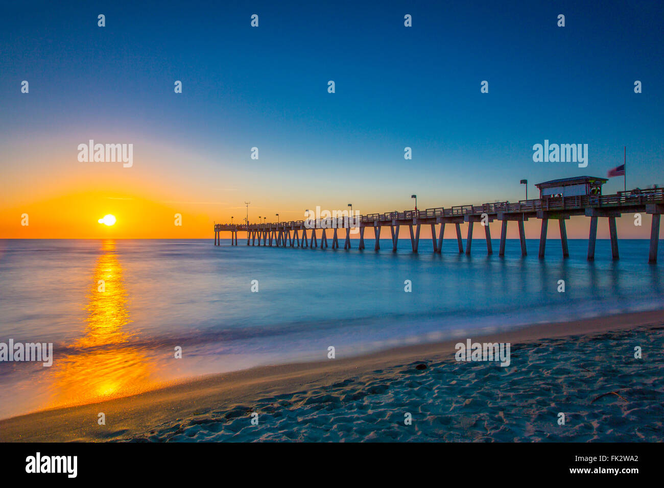 Sunset over Gulf of Mexico and Venice Pier in Venice Florida Stock Photo