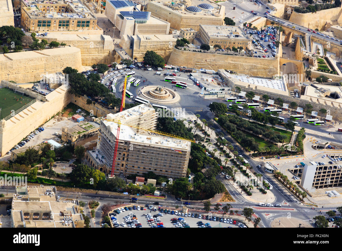 Aerial view of Valletta bus station, with the new city gate and renovation of the Phoenicia Hotel. Stock Photo