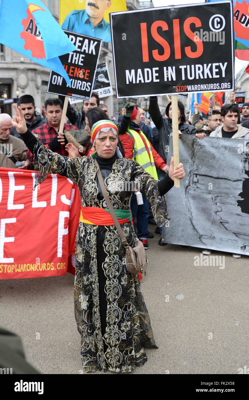 London, UK. 6th March 2016. Protester in traditional Kurdish clothing holds up a placard. Credit:  Marc Ward/Alamy Live News Stock Photo