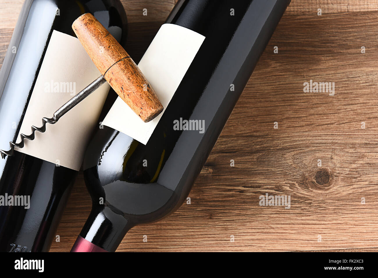 Top view of wine bottles and corkscrew with copy space. Stock Photo