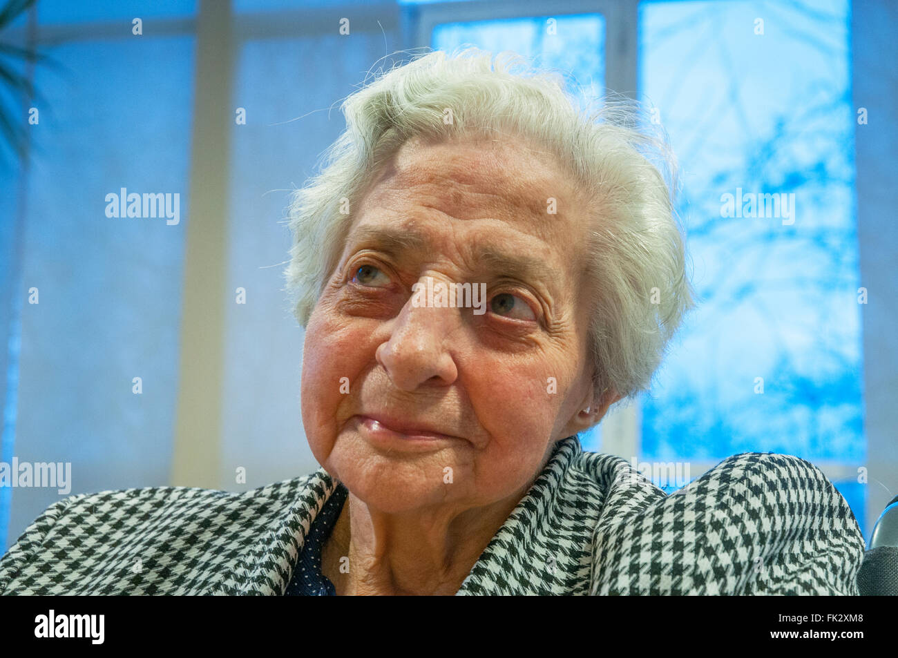 Portrait of old lady in a nursing home, looking up. Stock Photo