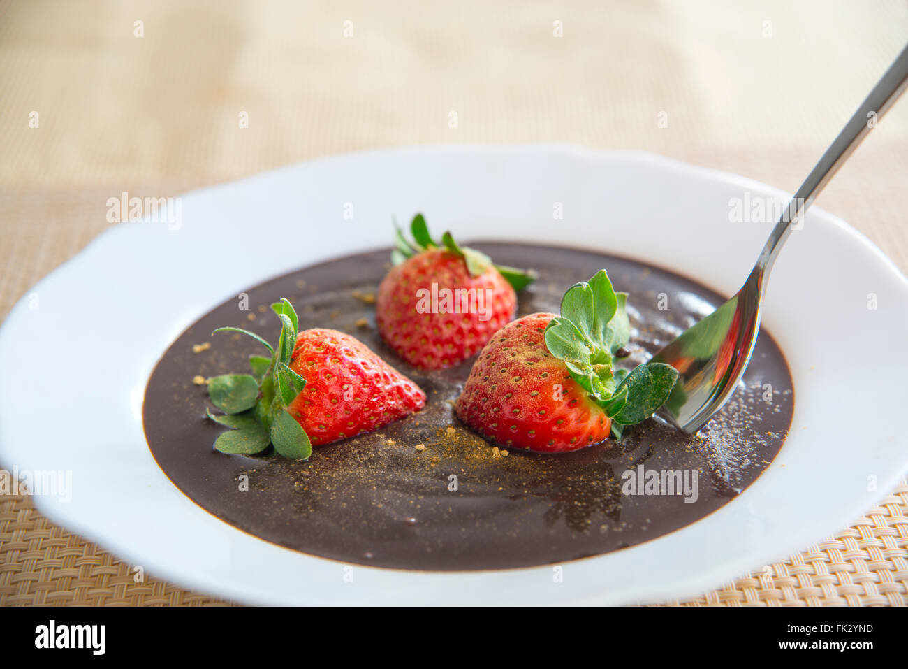 Chocolate cream with strawberries and ginger. Close view. Stock Photo