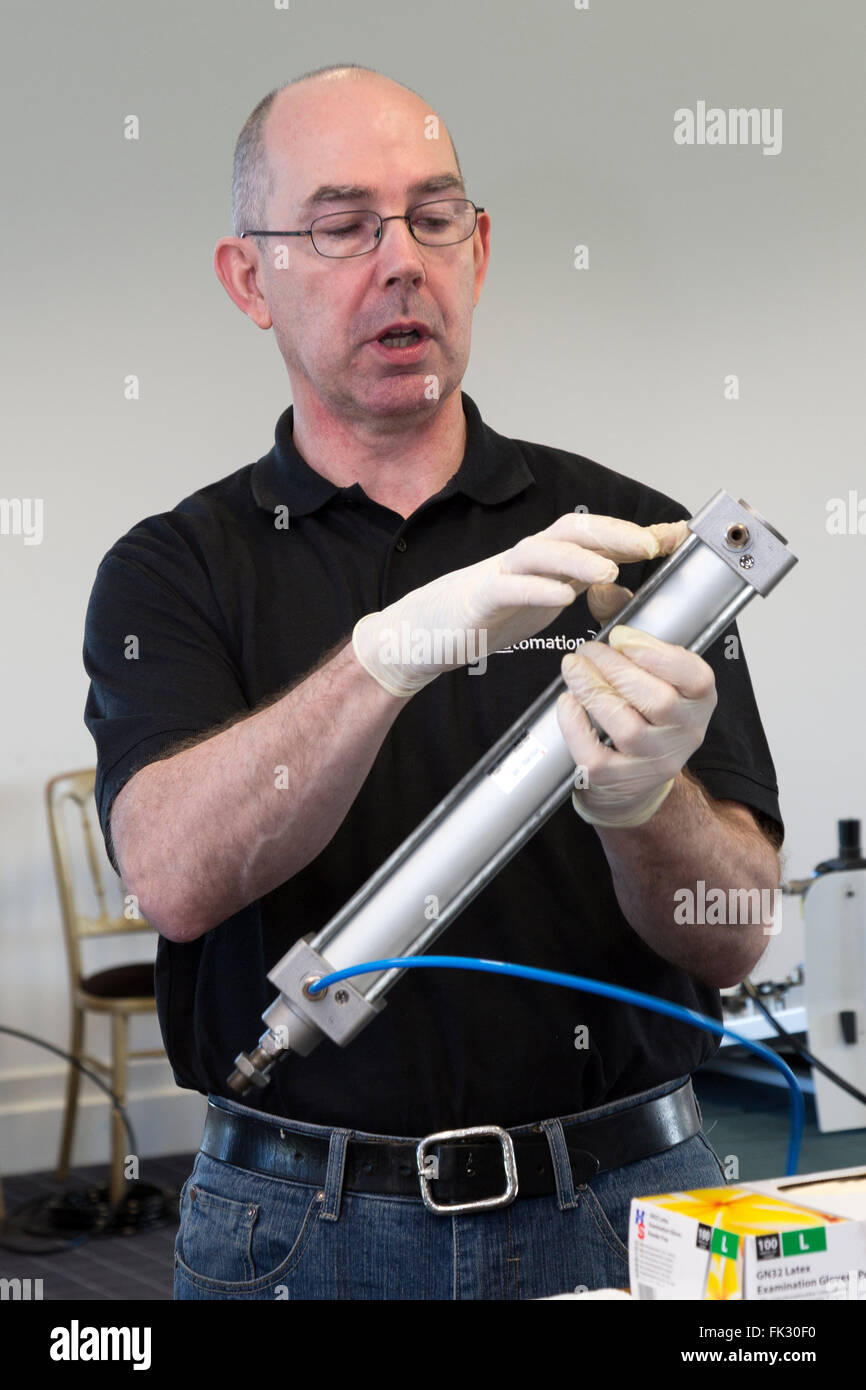 Engineering instructor with equipment in classroom. Stock Photo