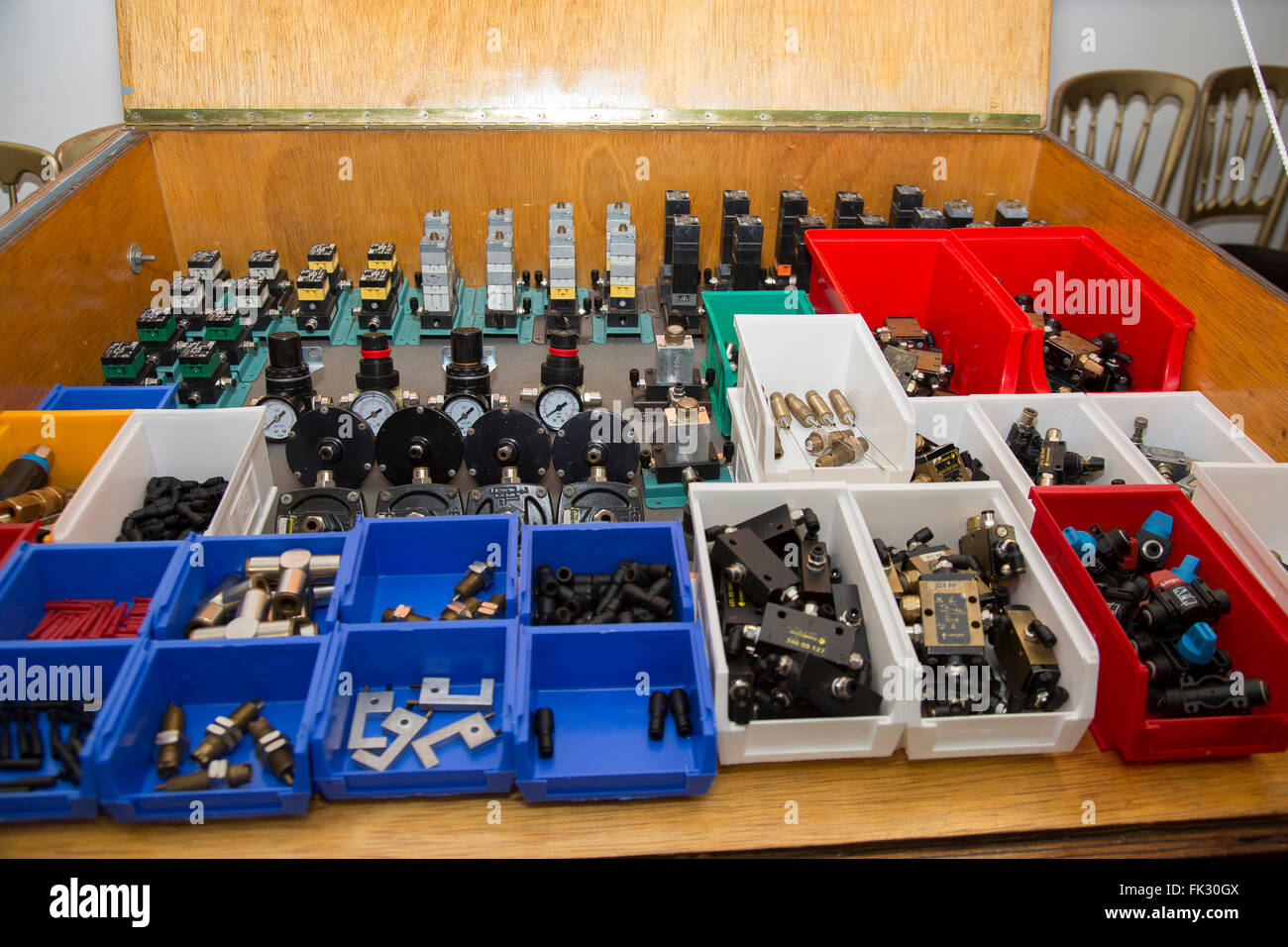 Electrical and engineering components in storage boxes. Stock Photo