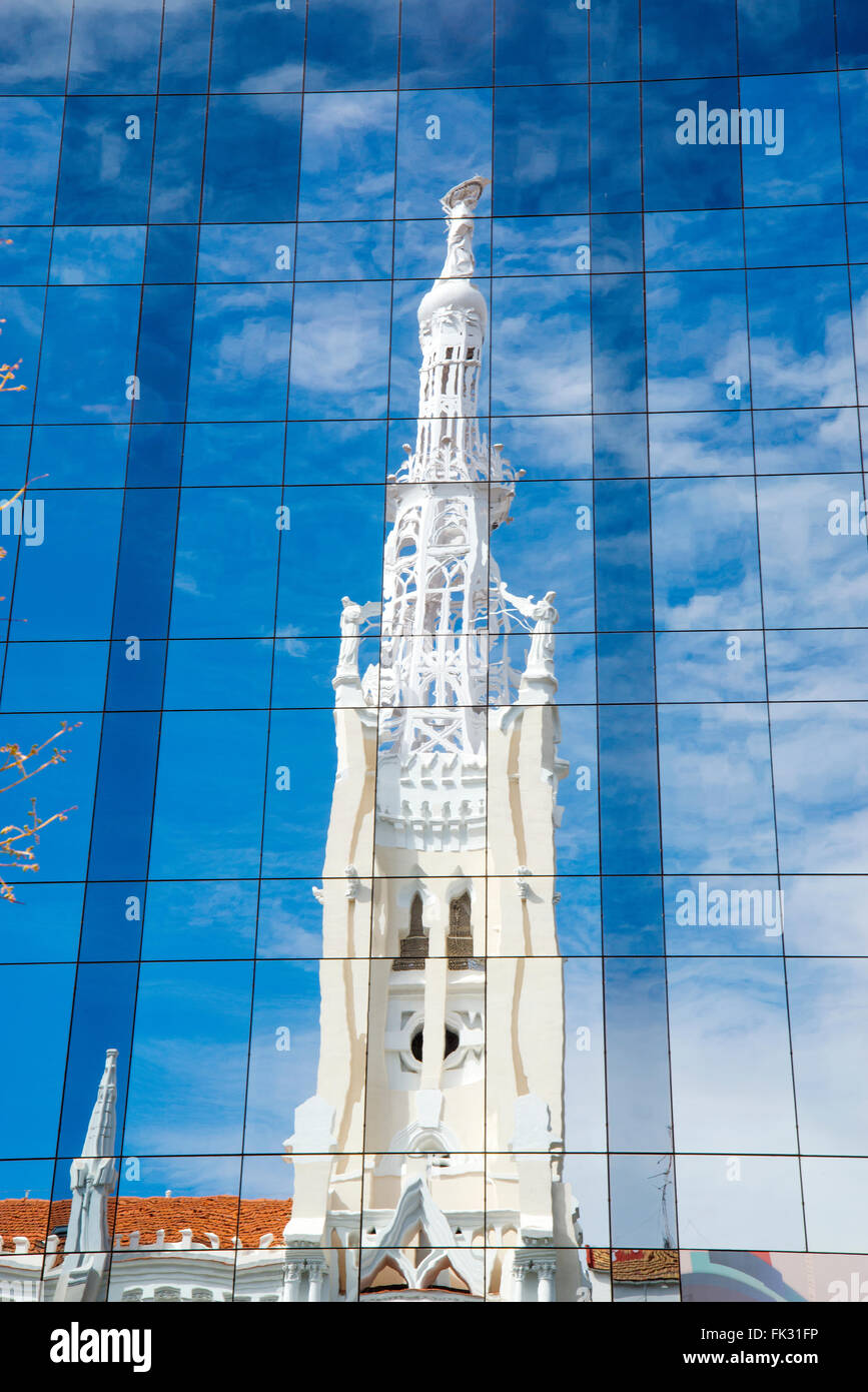 La Concepcion church reflected on glass facade. Goya street, Madrid, Spain. Stock Photo