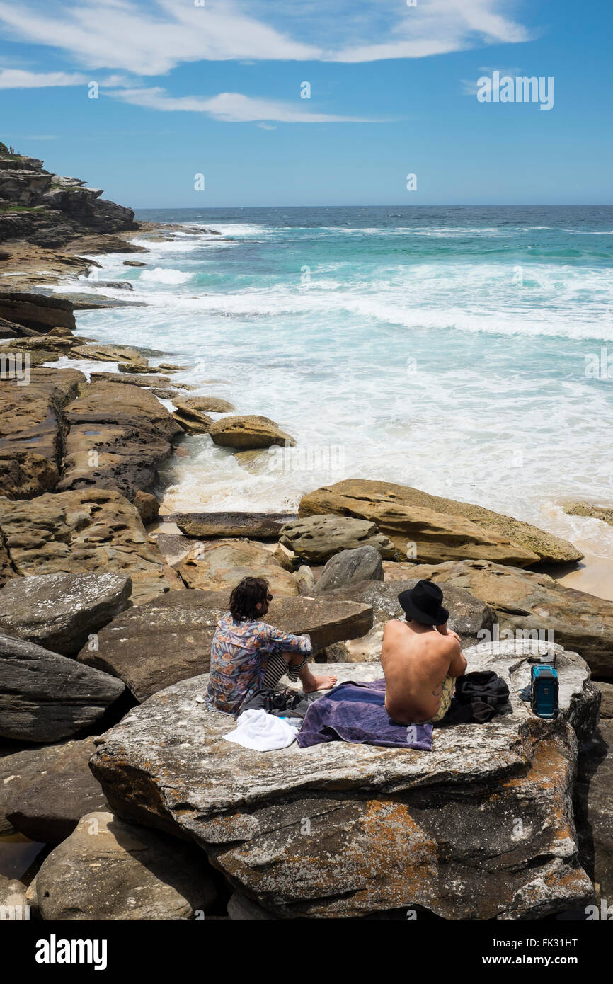 two men looking at the view along the Coogee to Bondi coastal walk, Sydney, NSW, Australia Stock Photo