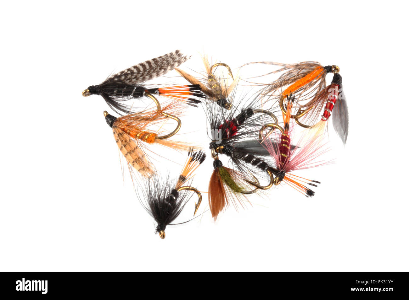 Handmade flies used by fishermen to attract trout and salmon by game fishermen. Stock Photo
