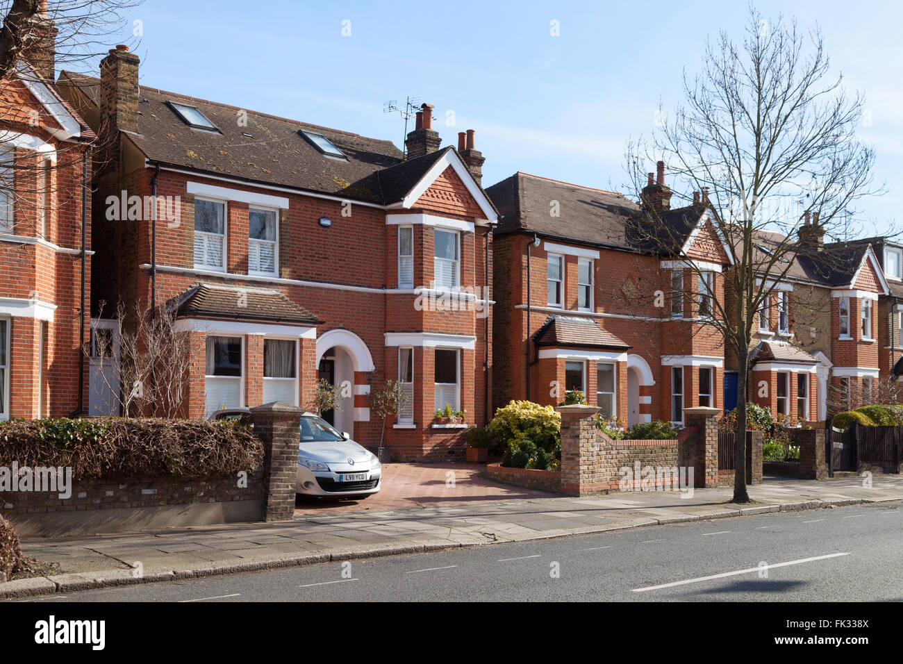 Detached houses on a street in Ealing, West London, UK Stock Photo