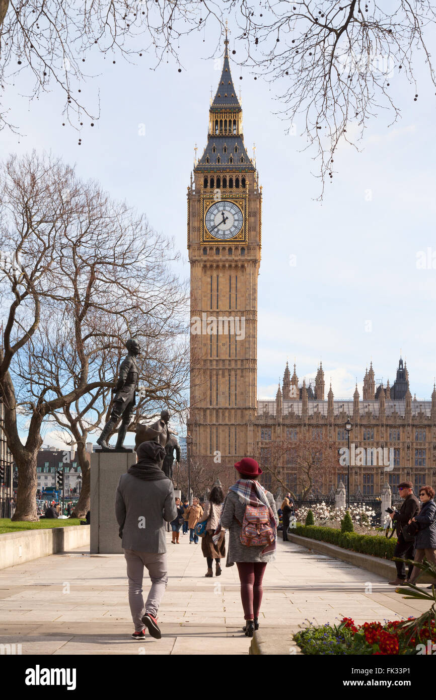 Tourist couple looking at Big Ben clock, Parliament Square in spring, Parliament Square, London city centre, UK Stock Photo