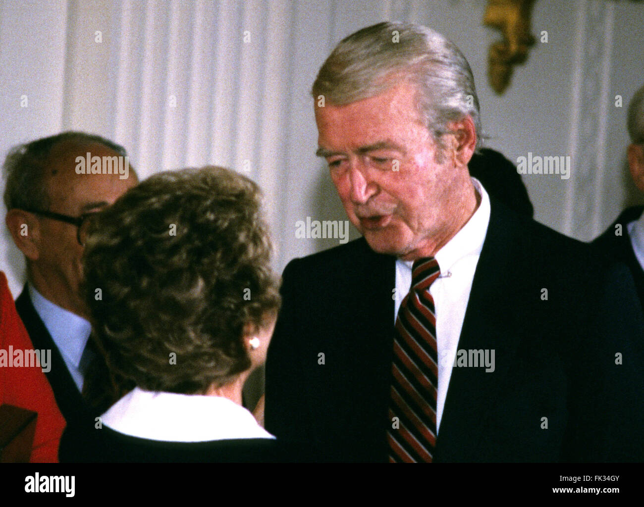 Washington, District of Columbia, USA. 23rd May, 1985. First lady Nancy Reagan congratulates actor Jimmy Stewart after he received the Presidential Medal of Freedom from United States President Ronald Reagan during a ceremony in the East Room of the White House in Washington, DC on May 23, 1985.Credit: Arnie Sachs/CNP © Arnie Sachs/CNP/ZUMA Wire/Alamy Live News Stock Photo