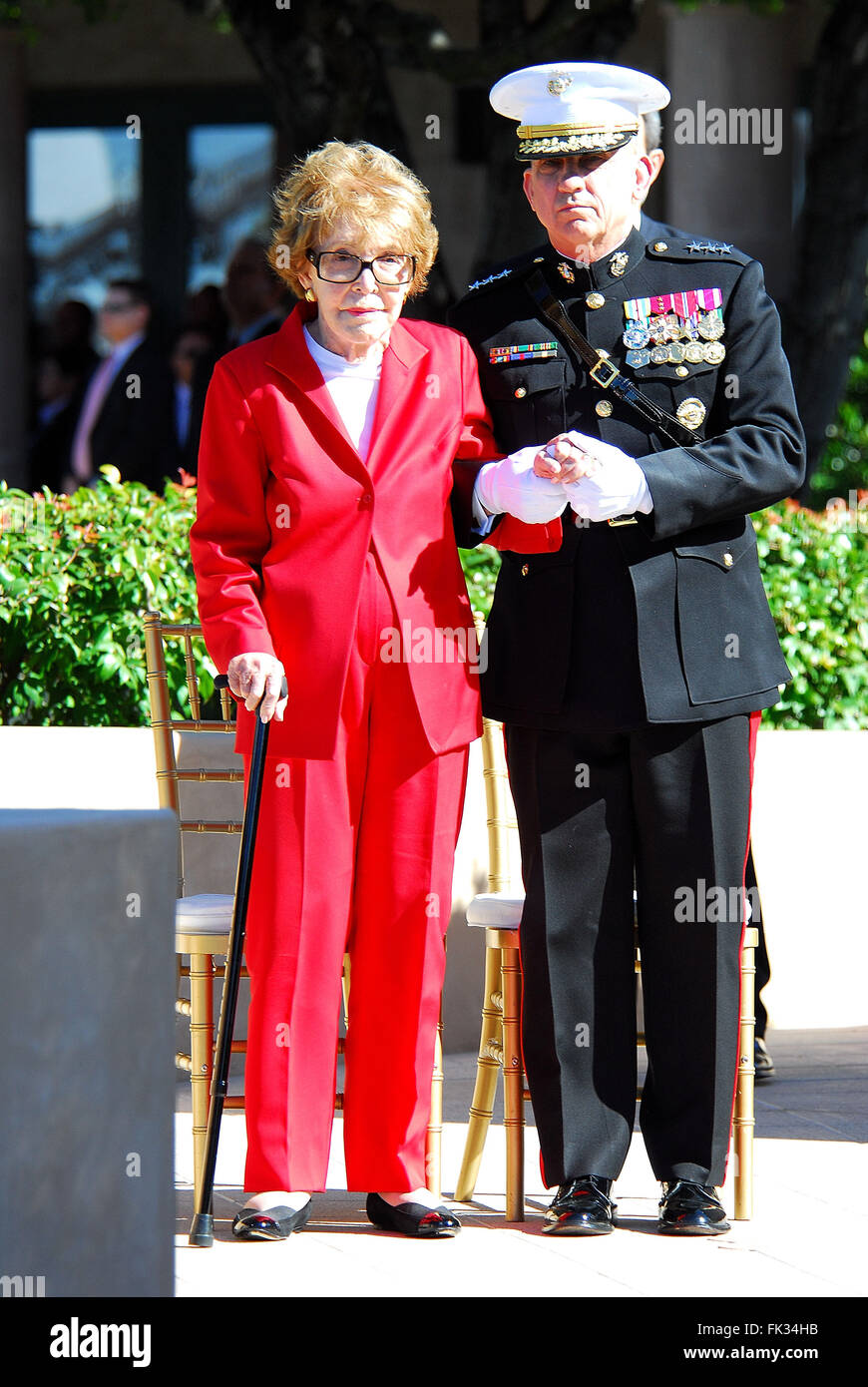 March 6, 2016 - NANCY REAGAN, Ronald Reagan's widow and First Lady from 1981-1989, has died at 94. The cause of death was congestive heart failure. Pictured: Feb. 6, 2011 - Simi Valley, California, U.S. - Former US first lady NANCY REAGAN is escorted by Marine Corps Lieutenant General GEORGE J. FLYNN at the memorial site which serves as her husband's final resting place to lay a wreath during the centennial birthday celebration for former US president Ronald Reagan at the Reagan Presidential Library. (Credit Image: © Valerie Nerres/ZUMAPRESS.com) Stock Photo