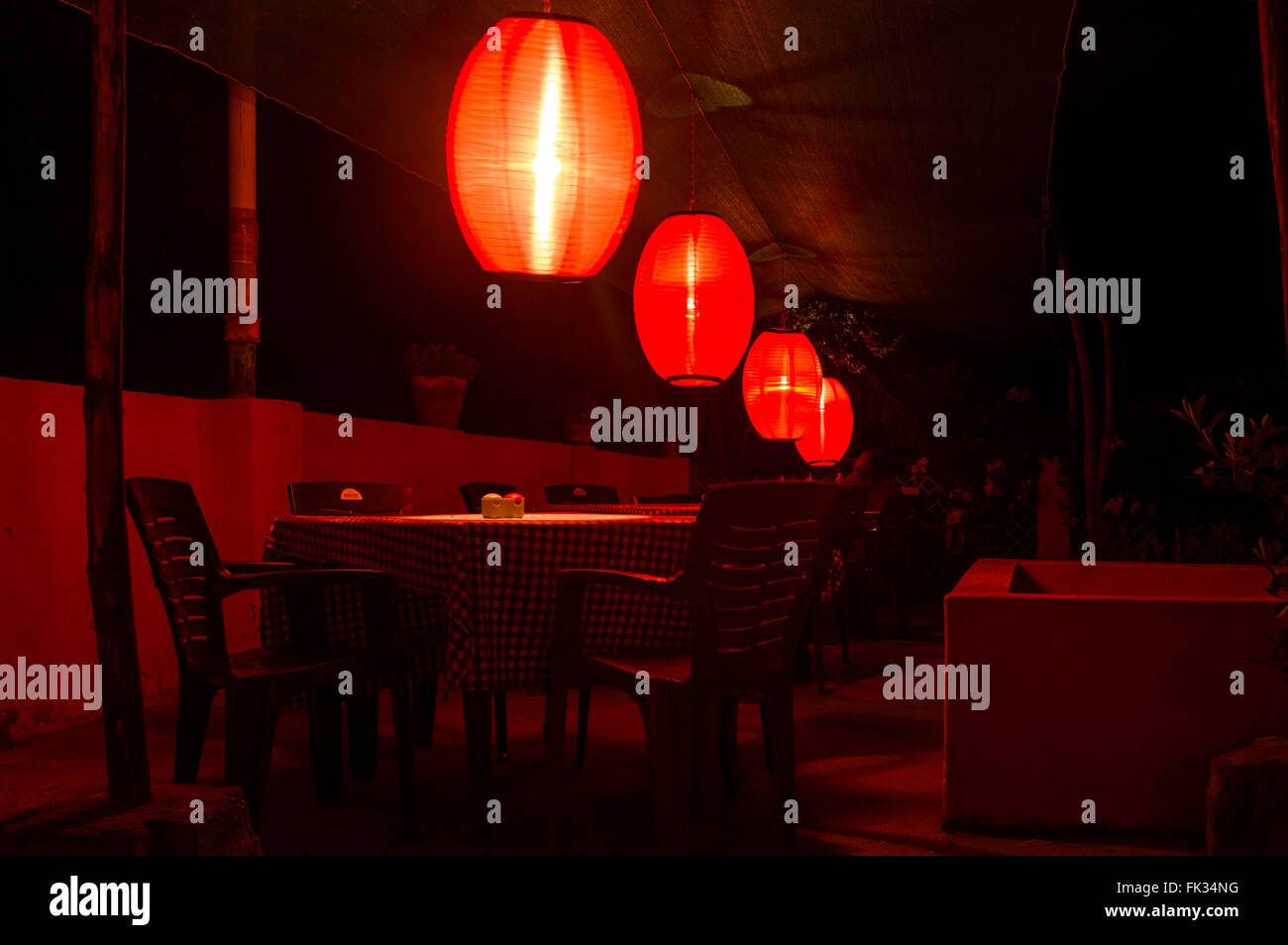 Interior of an Indian Restaurant decorated with beautiful lights at night Stock Photo