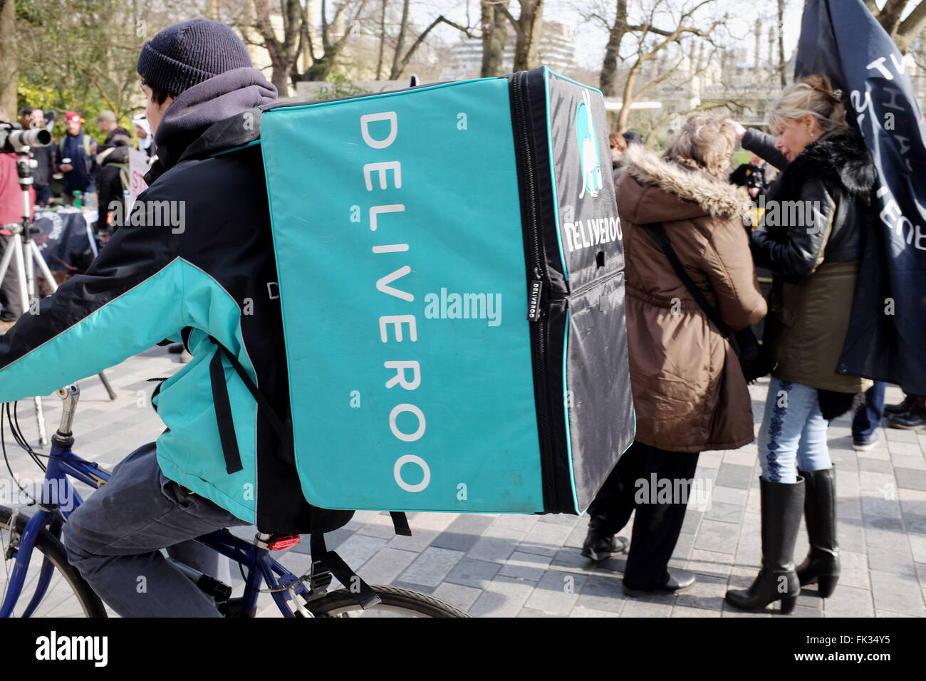 Deliveroo fast food meals on wheels cyclist delivery service peddles