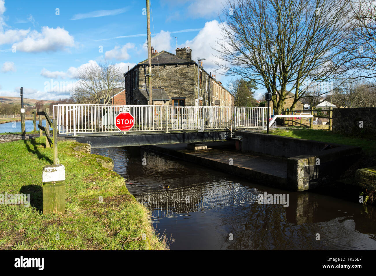 Little Clegg swing bridge on the Rochdale Canal, between Rochdale and Littleborough, Greater Manchester, England, UK Stock Photo