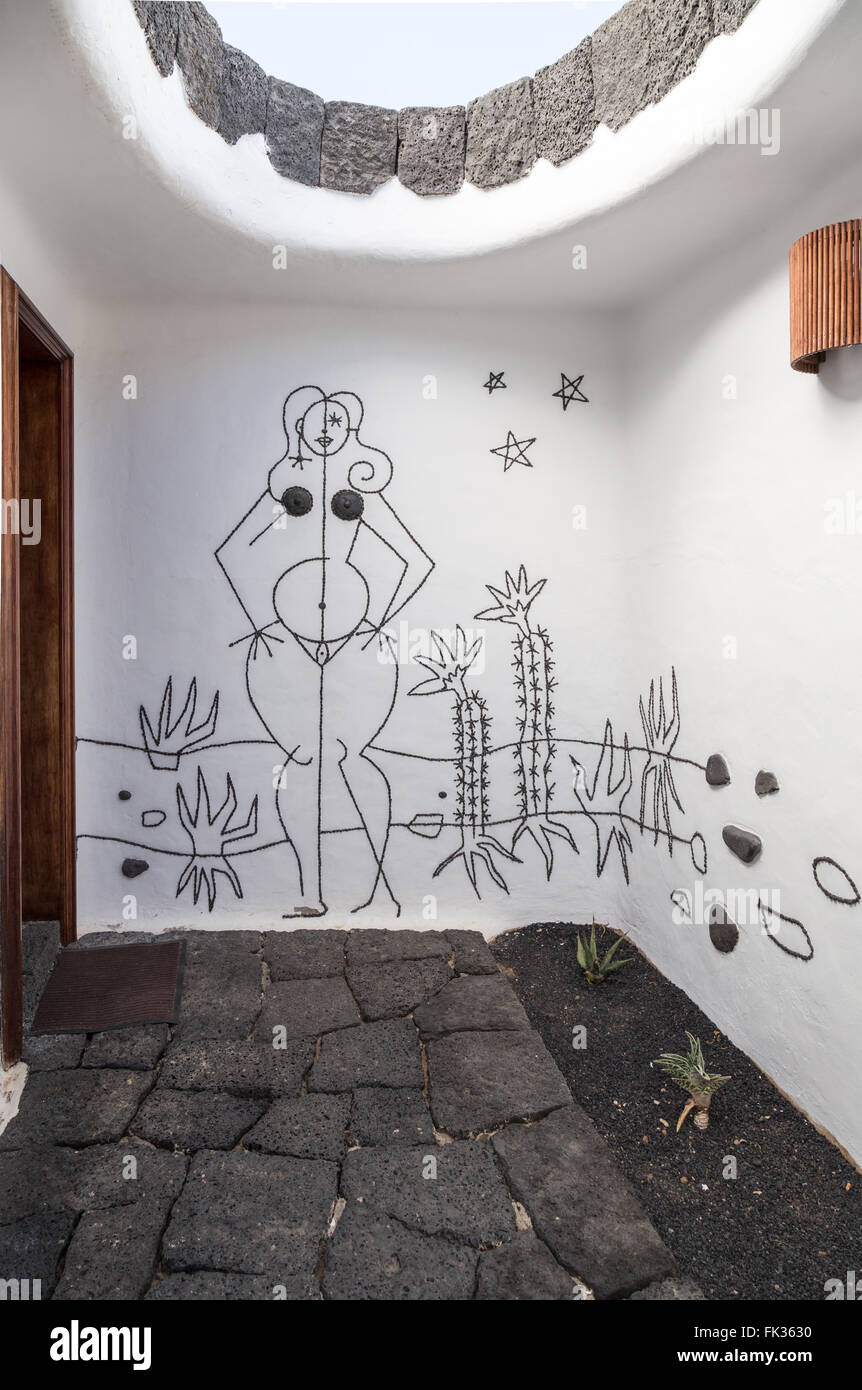 Artwork by César Manrique at the entrance to the Women's toilet at the Lanzarote Cactus Garden. Stock Photo