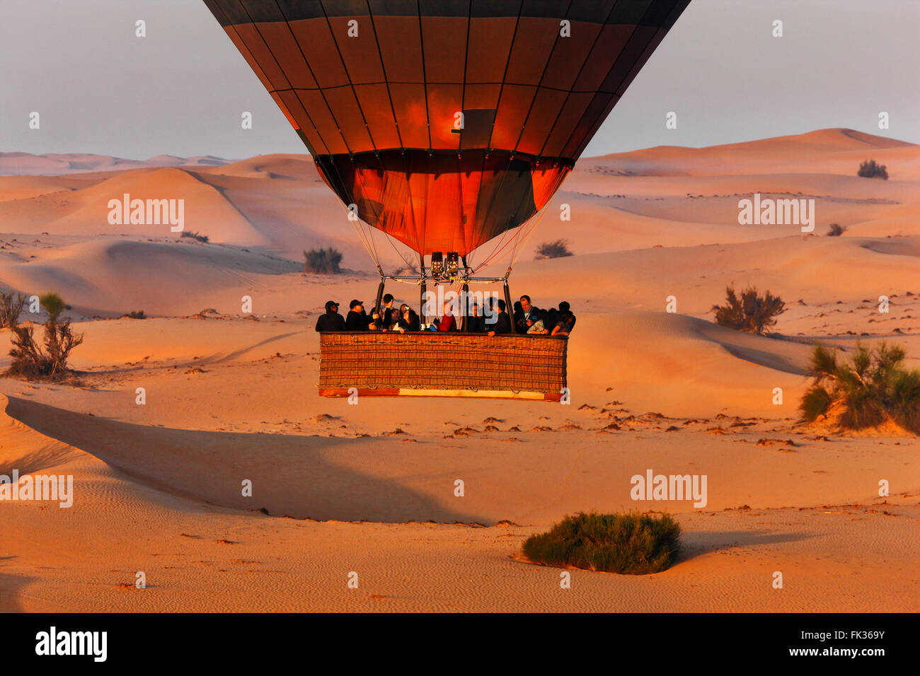 Hot air balloon fly over Dubai desert. Stock Photo