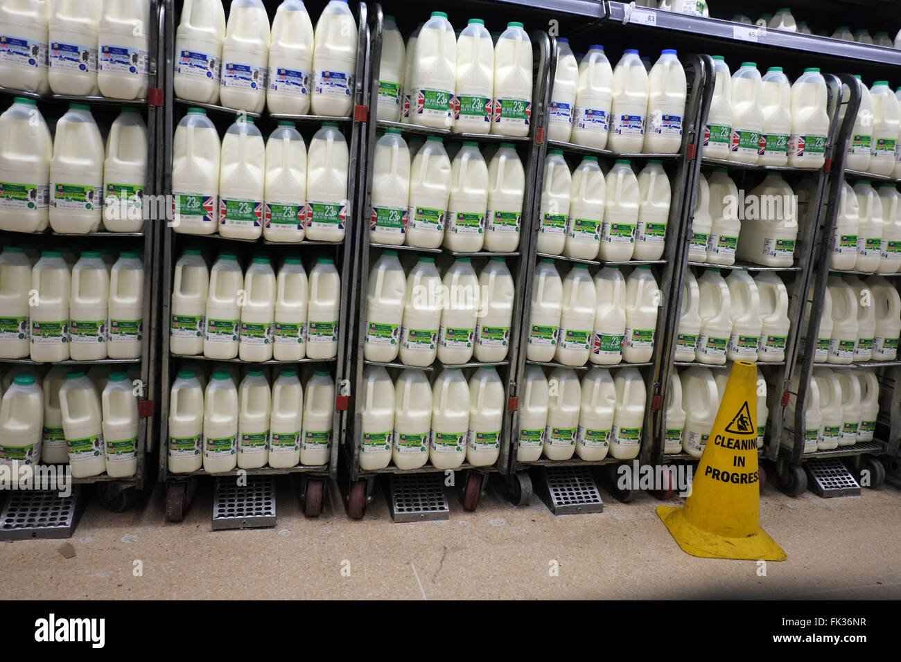 Superstore display of mike in plastic containers, Morrisons supermarket