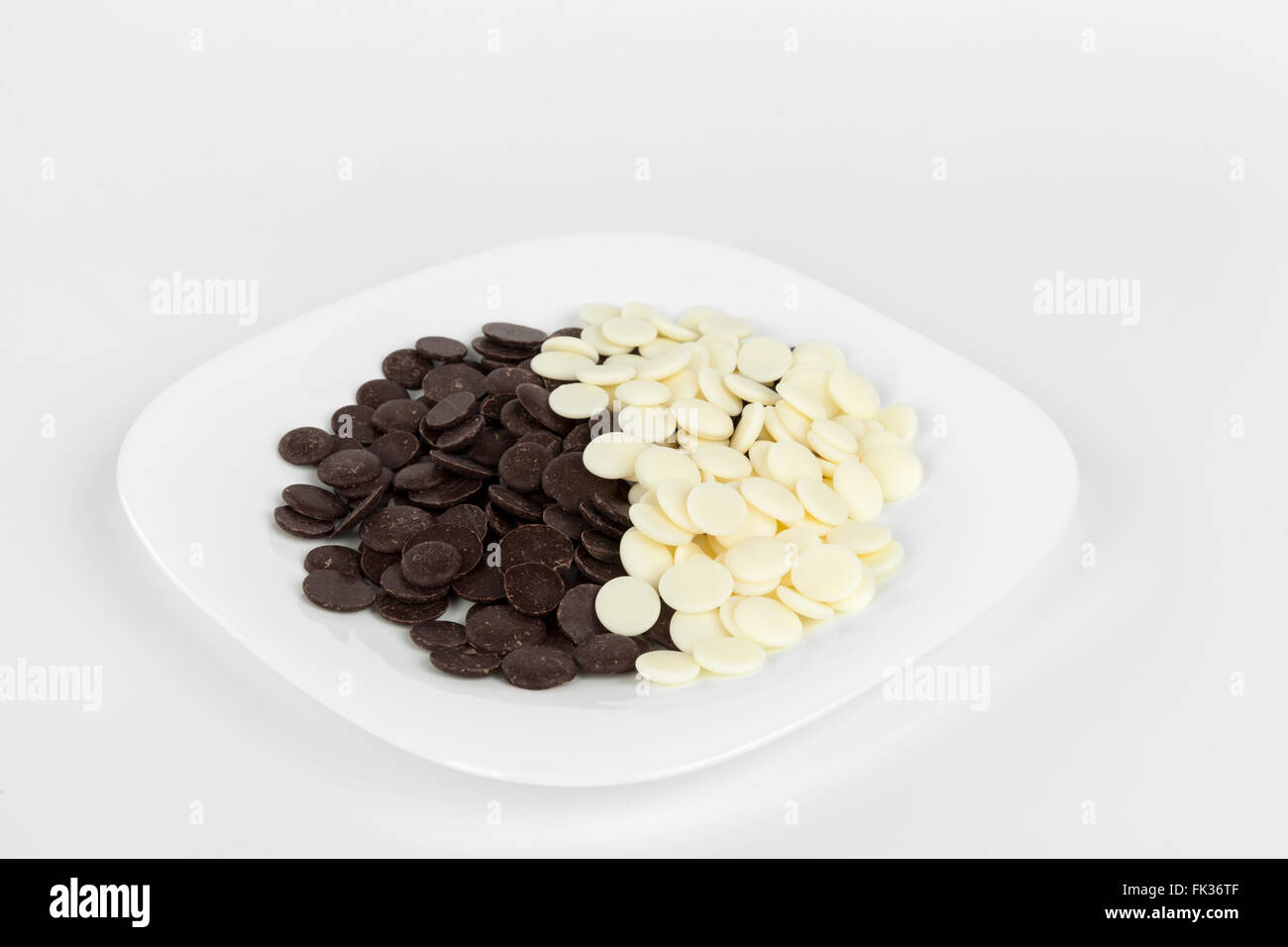 black and white chocolate on white plate Stock Photo