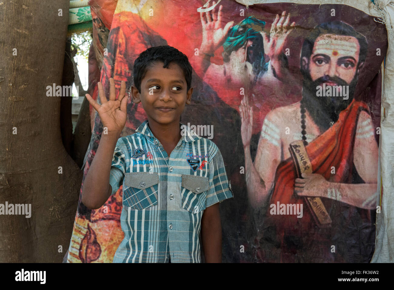 Boy In Front Of Hindu Poster, Mathiyazagan, Tiruvannamalai Stock Photo