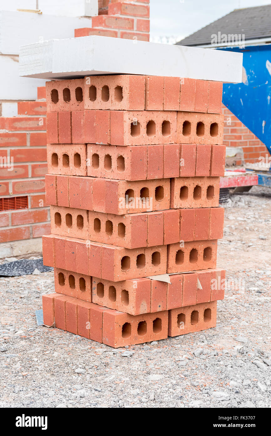 House in various stages of construction stack of bricks Stock Photo Alamy