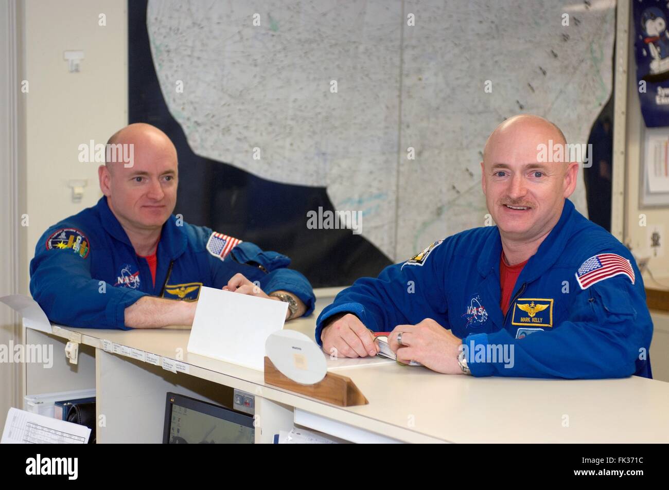 NASA astronauts Scott Kelly (left) and identical twin brother Mark Kelly during check-out at Ellington Field Johnson Space Center May 6, 2008 in Houston, Texas. Stock Photo