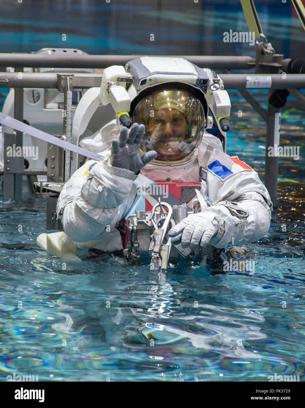 ESA astronaut Thomas Pesquet in his Extravehicular Mobility Unit space suit during ISS EVA maintenance training at the Neutral Buoyancy Laboratory Johnson Space Center January 12, 2016 in Houston, Texas. Stock Photo