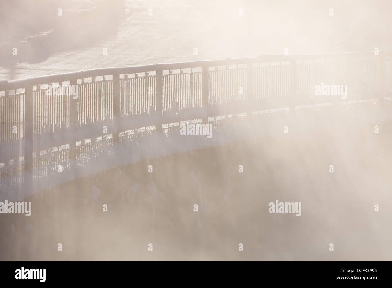 Railing in morning fog Stock Photo