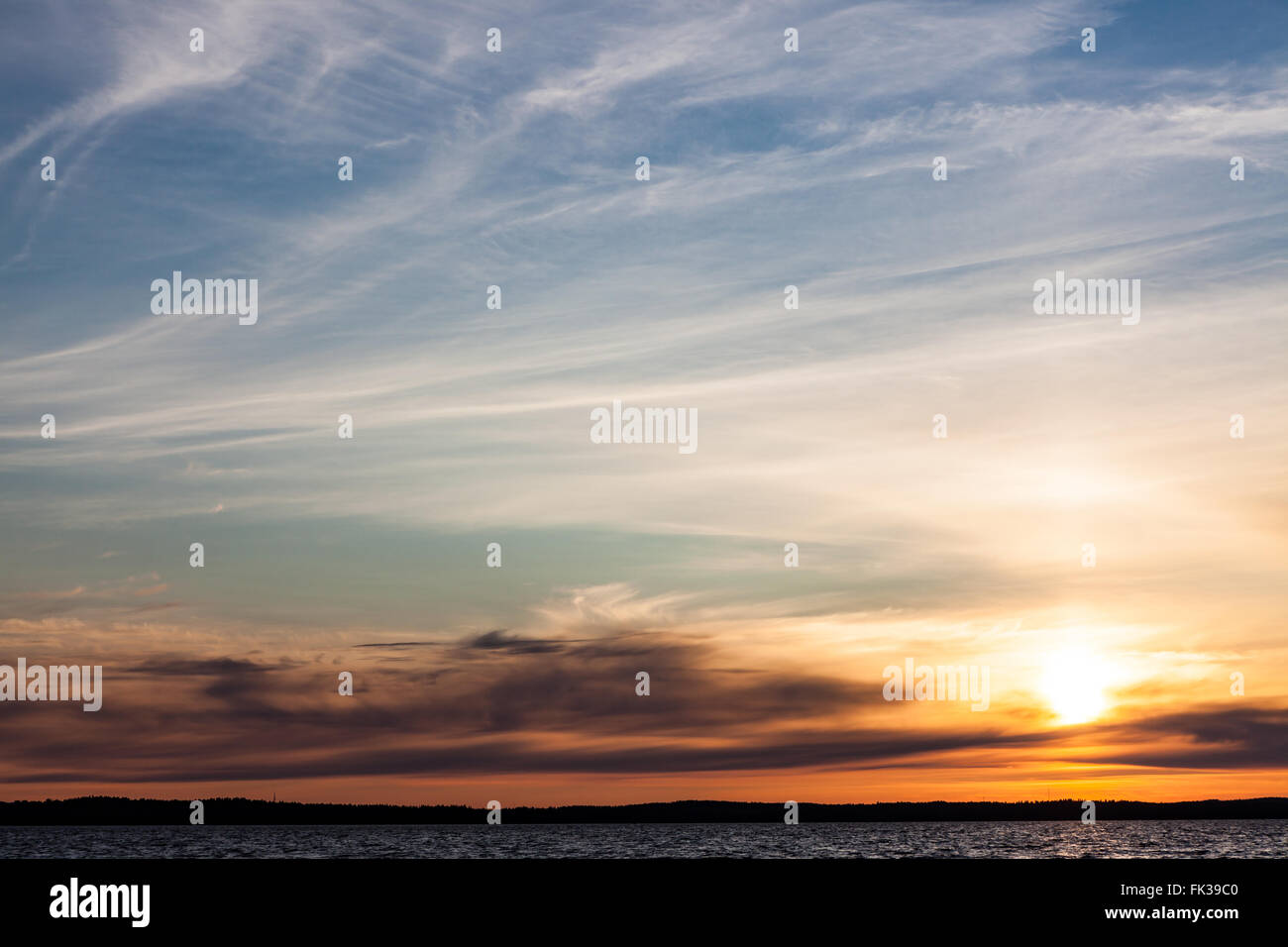 Calm sunset and clouds over lake Stock Photo - Alamy