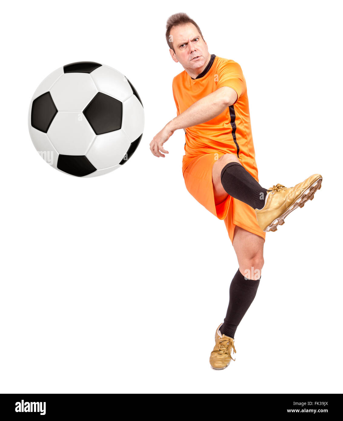 Faceless person standing with soccer ball between legs on grass · Free  Stock Photo