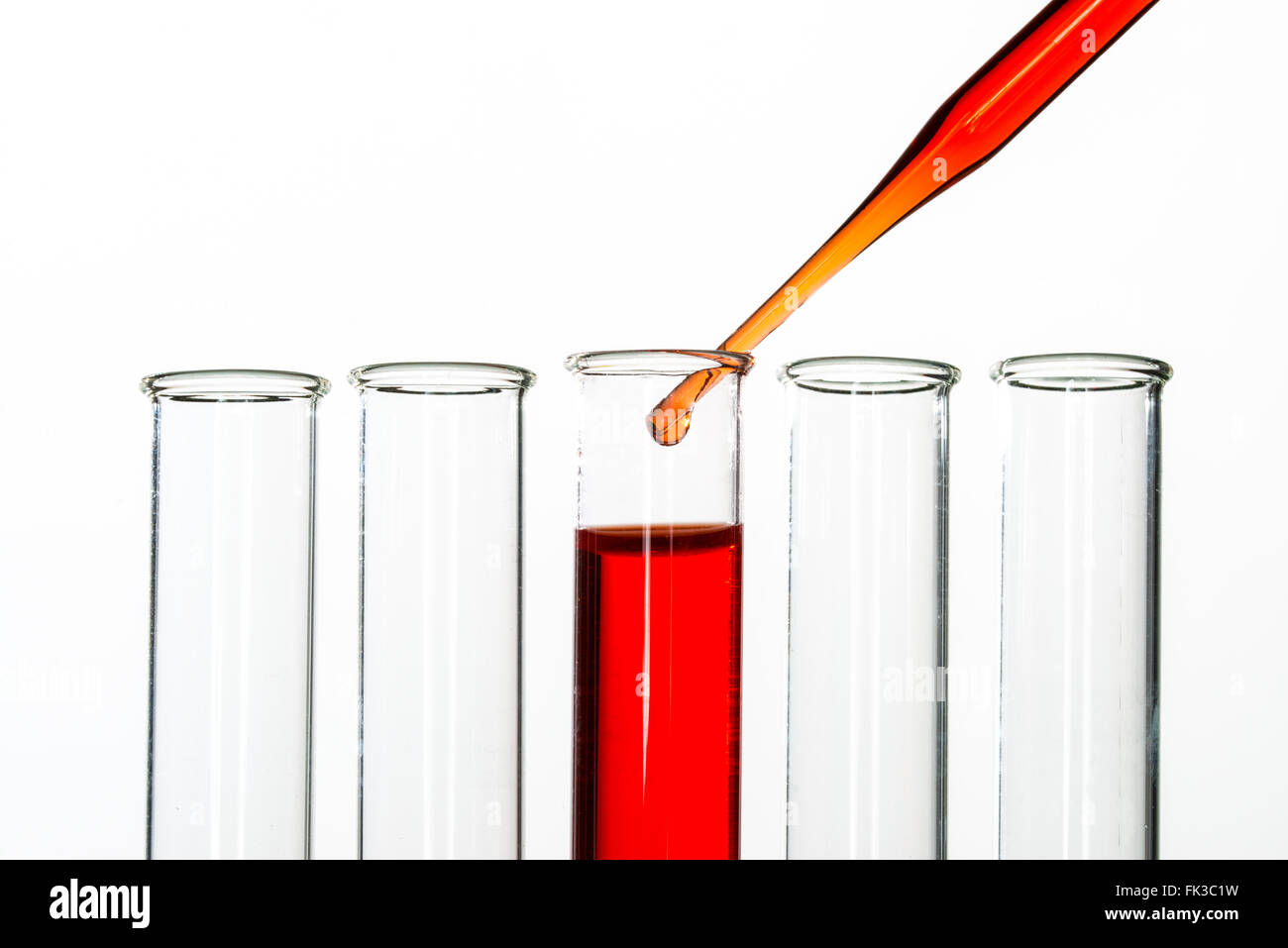 Test tubes and pipette drop, Laboratory Glassware for chemical research Stock Photo