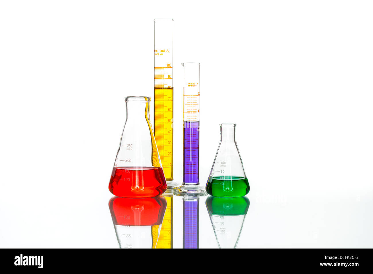 science Laboratory Glassware, reflective white table for chemical research Stock Photo