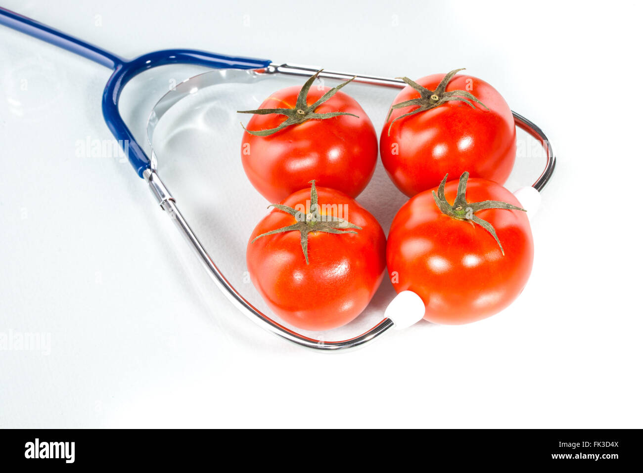 Agricultural diagnose,  tomato, stethoscope Stock Photo