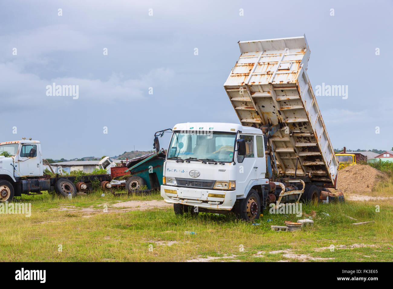 Rusting FAW Automotive tipper truck, Ogg Spencer's Trucking scrapyard, Liberta, south Antigua, Antigua and Barbuda, West Indies Stock Photo