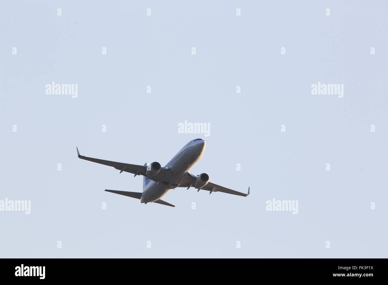Airplane flying in the sky Stock Photo - Alamy