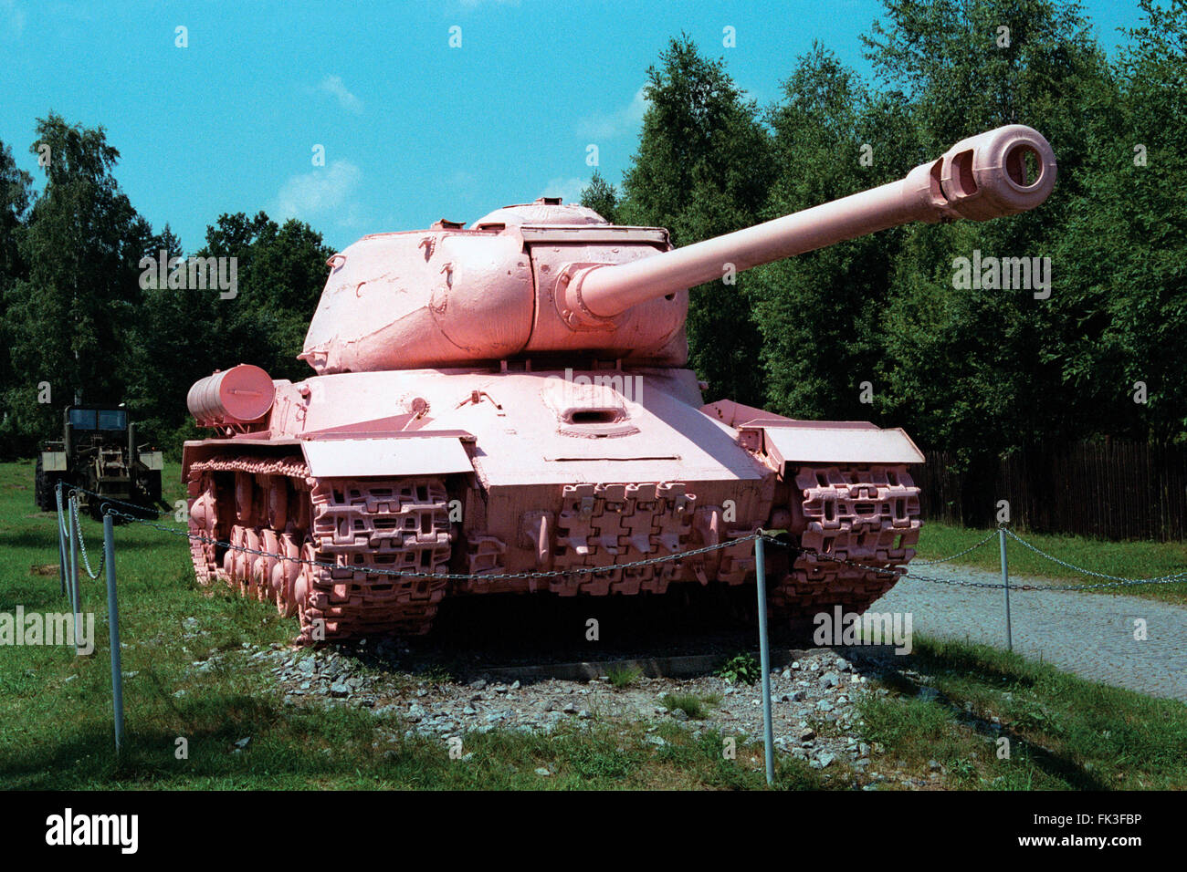Famous Pink Tank IS-2 painted pink by Czech visual artist David Cerny displayed in the Military Technical Museum in Lesany, Czech Republic. Soviet heavy tank IS-2 formerly known as No 23 used to be the Monument to Soviet Tank Crews in Prague, Czechoslovakia. It was controversially painted pink by art student David Cerny and friends in 1991 and later moved to the museum. The model IS-2 was named after Soviet dictator Joseph Stalin. Stock Photo