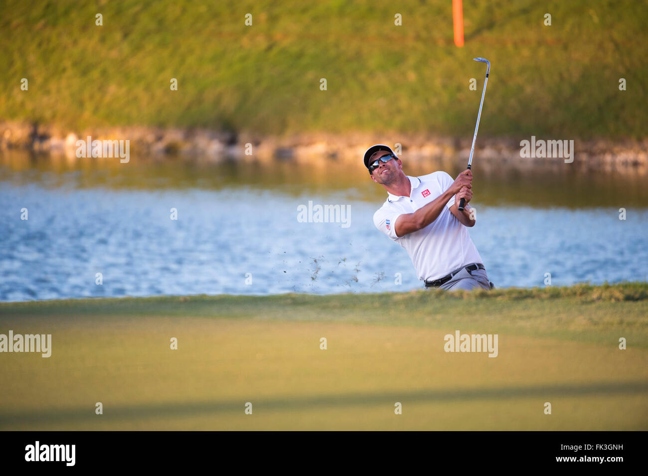 Doral, Florida, USA. 06th Mar, 2016. Adam Scott of Australia chips at the 18th hole during the final round of the World Golf Championships-Cadillac Championship on the TPC Blue Monster course at the Trump Doral Golf Club and Resort in Doral, FL. Credit:  Action Plus Sports/Alamy Live News Stock Photo