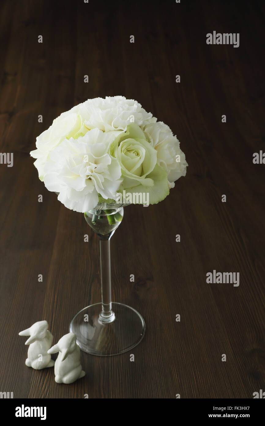 White roses in a glass Stock Photo - Alamy