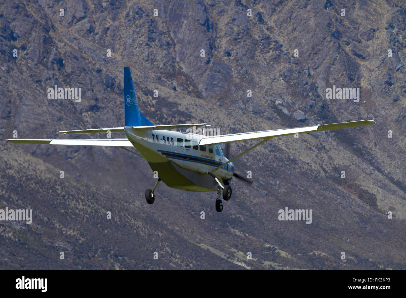 Air Milford tourist plane (Cessna 208) landing at Queenstown Airport, Otago, South Island, New Zealand Stock Photo